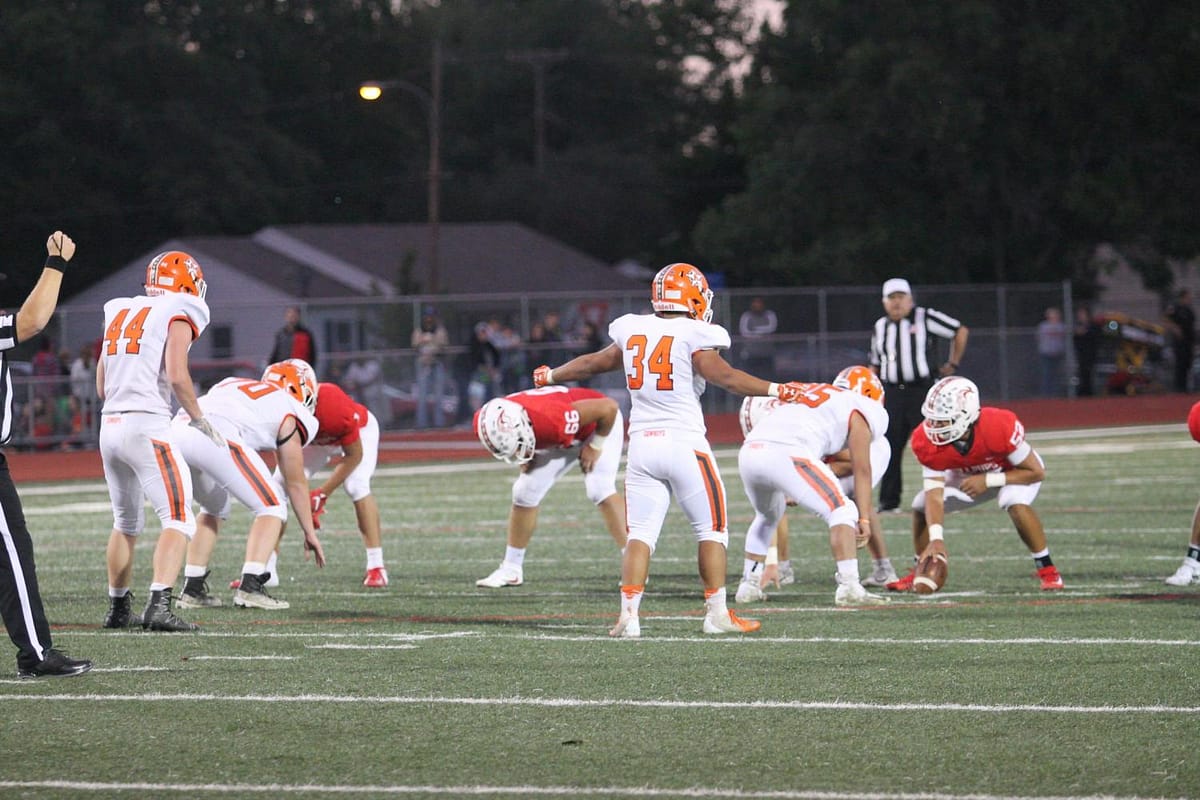Linebacker Logan Anguiano (34) calls out a coverage shift before a McPherson play.