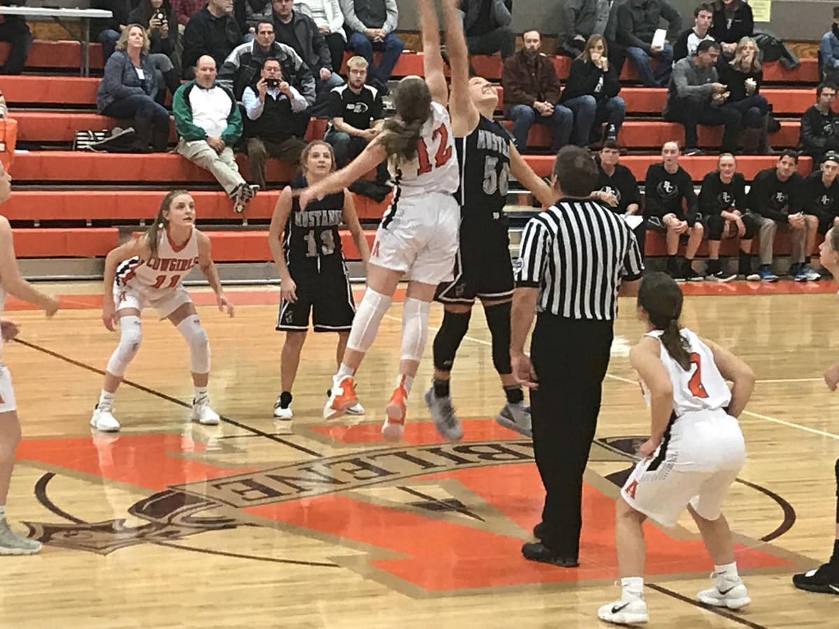 Jade, 2, watches the ball off the tip at the beginning of the game against Rock Creek.