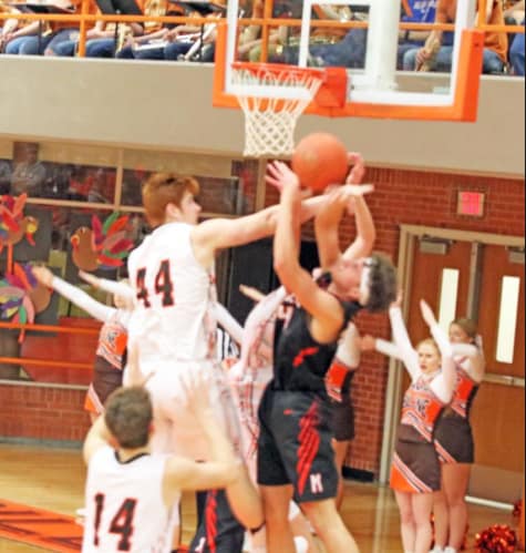 Preston Boyd (44) engages in a rebound battle against Marysville.