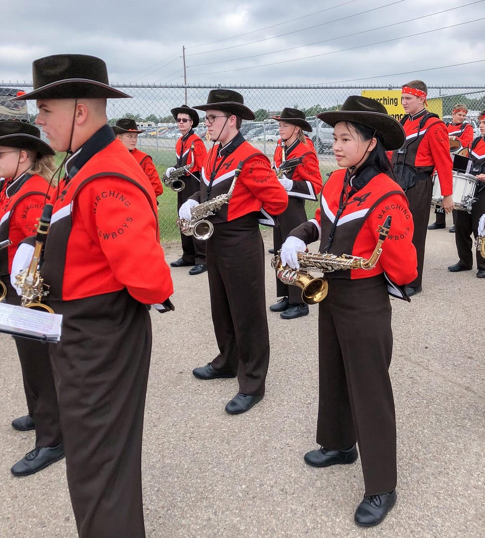 AHS band students standing at parade rest before contest